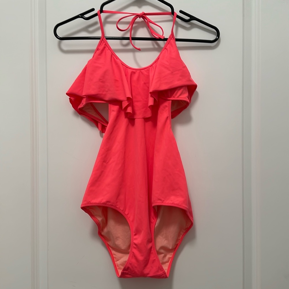 Victoria’s Secret one piece swimsuit, looks like bikini in the back